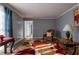 Inviting living room with cozy seating, a decorative rug, and neutral wall color at 6432 Phillips Pl, Lithonia, GA 30058