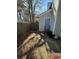 Small backyard with a patio and wooden fence at 1023 Thornwoode Ln, Stone Mountain, GA 30083