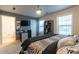 Bedroom featuring a queen size bed with zebra stripe accents, as well as a doorway to the bathroom at 1023 Thornwoode Ln, Stone Mountain, GA 30083