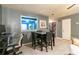 Comfortable dining area with a small table, view to kitchen, and adjacent workspace at 1023 Thornwoode Ln, Stone Mountain, GA 30083