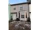 Two-story townhouse with gray siding, a bay window, and a small front yard at 1023 Thornwoode Ln, Stone Mountain, GA 30083