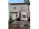 Two-story townhouse with gray siding, a bay window, and a small front yard at 1023 Thornwoode Ln, Stone Mountain, GA 30083