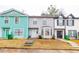 Charming townhomes featuring unique architecture, colorful exteriors and well-maintained yards at 1023 Thornwoode Ln, Stone Mountain, GA 30083