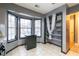 Kitchen area featuring grey cabinets, a large window and a built in pantry at 1023 Thornwoode Ln, Stone Mountain, GA 30083