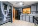 Kitchen featuring granite counters, stainless appliances, grey cabinets and tile flooring at 1023 Thornwoode Ln, Stone Mountain, GA 30083