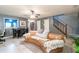 Bright living room featuring neutral decor, a ceiling fan, and tile flooring at 1023 Thornwoode Ln, Stone Mountain, GA 30083