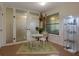 Charming breakfast nook featuring a small table and chairs, alongside display cabinet at 1414 Branch Dr, Tucker, GA 30084