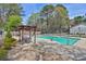 Community pool area with lounge chairs and shaded seating, perfect for relaxation and socializing at 1414 Branch Dr, Tucker, GA 30084