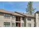 Apartment building exterior with visible windows and multiple floors under a blue sky, ideal for housing at 1414 Branch Dr, Tucker, GA 30084