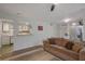 Living room, featuring a brown couch and kitchen passthrough at 1414 Branch Dr, Tucker, GA 30084