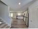 View of the kitchen and living area from the entryway at 15 Heyman Dr, Covington, GA 30016