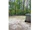 Spacious backyard with wooded backdrop and privacy fence at 115 Cainwood C W Ct, Atlanta, GA 30349