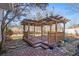 Backyard with wooden deck and pergola, perfect for outdoor entertaining at 1491 Laurel River Trl, Lawrenceville, GA 30043