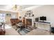 Living room with fireplace, leather furniture, and area rug at 1491 Laurel River Trl, Lawrenceville, GA 30043