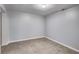 Empty basement room with tile flooring and neutral walls at 2502 Tyler Way, Decatur, GA 30032