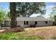 Gray house exterior with a large backyard and mature trees at 2502 Tyler Way, Decatur, GA 30032