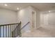 Upstairs hallway with carpet and access to bedrooms at 254 Arnewood Cir, Mcdonough, GA 30253