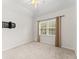 Spacious bedroom with ceiling fan and large windows at 801 Treadstone Overlook, Suwanee, GA 30024