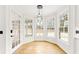 Bright breakfast nook features hardwood floors, bay window, and pendant lighting at 801 Treadstone Overlook, Suwanee, GA 30024