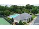 Community pool and clubhouse with tennis courts nearby at 801 Treadstone Overlook, Suwanee, GA 30024