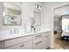 Bathroom with double sinks and mirrors with an attached bedroom at 412 Southbridge Pass, Peachtree City, GA 30269