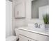 Cozy bathroom features a toilet, vanity, and cabinet, blending functionality with a clean aesthetic at 412 Southbridge Pass, Peachtree City, GA 30269