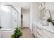 A bathroom showcasing a glass-enclosed shower, double vanity, and stylish fixtures at 412 Southbridge Pass, Peachtree City, GA 30269
