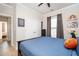 A spacious bedroom with a bed, hardwood flooring, and decorative wall art at 412 Southbridge Pass, Peachtree City, GA 30269
