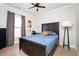 Bedroom featuring hardwood floors, closet, and artwork at 412 Southbridge Pass, Peachtree City, GA 30269