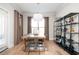 Bright dining room with hardwood floors, contemporary decor, and a door to the outside at 412 Southbridge Pass, Peachtree City, GA 30269