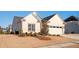 Beautiful shot of the home showing manicured lawn and landscaping at 412 Southbridge Pass, Peachtree City, GA 30269