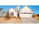 Charming single-story home with a well-manicured lawn and attached two-car garage at 412 Southbridge Pass, Peachtree City, GA 30269