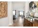 Elegant hallway with hardwood floors, stylish decor, and a view into the living and dining areas at 412 Southbridge Pass, Peachtree City, GA 30269