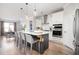 Modern kitchen with a large island, stainless steel appliances, and an open layout into the dining area at 412 Southbridge Pass, Peachtree City, GA 30269