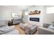 Comfortable living room with shiplap fireplace and neutral decor, creating a relaxing atmosphere at 412 Southbridge Pass, Peachtree City, GA 30269