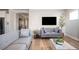 Open-concept living room with hardwood floors and neutral color palette at 412 Southbridge Pass, Peachtree City, GA 30269