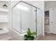 A tiled shower with a glass enclosure at 412 Southbridge Pass, Peachtree City, GA 30269