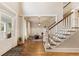 Bright and airy entryway with hardwood floors and staircase at 405 Maple Rdg, Cumming, GA 30028