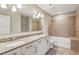 Double vanity bathroom with granite countertops and tile shower/tub at 950 W Peachtree Nw St # 812, Atlanta, GA 30309