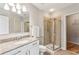 Modern bathroom with granite countertop, walk-in shower, and updated fixtures at 950 W Peachtree Nw St # 812, Atlanta, GA 30309