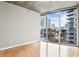 Bedroom with hardwood floors and large windows with city views at 950 W Peachtree Nw St # 812, Atlanta, GA 30309