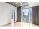 Bright bedroom with hardwood floors and access to balcony at 950 W Peachtree Nw St # 812, Atlanta, GA 30309