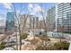 Community courtyard with pool, trees, and seating areas at 950 W Peachtree Nw St # 812, Atlanta, GA 30309