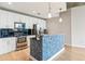 Modern kitchen with white cabinetry, stainless steel appliances, and mosaic backsplash at 950 W Peachtree Nw St # 812, Atlanta, GA 30309