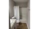 Clean bathroom with a shower/tub combo, toilet, and granite countertop vanity at 10561 Aspenwood Ct, Jonesboro, GA 30238