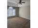 Bright bedroom featuring a ceiling fan and neutral walls at 10561 Aspenwood Ct, Jonesboro, GA 30238