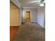 Open living space with hardwood and carpeted floors at 10561 Aspenwood Ct, Jonesboro, GA 30238