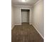 Small office with carpet and access to hallway at 10561 Aspenwood Ct, Jonesboro, GA 30238