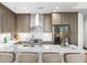 Modern kitchen with stainless steel appliances and white quartz countertops at 270 17Th Nw St # 1608, Atlanta, GA 30363