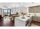 Open-concept living room boasts dark hardwood floors, modern lighting, and expansive city views from a large window at 270 17Th Nw St # 1608, Atlanta, GA 30363